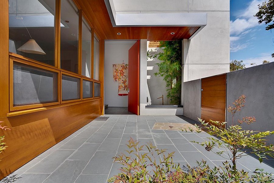 Natural wood siding complements the orange of the door perfectly!