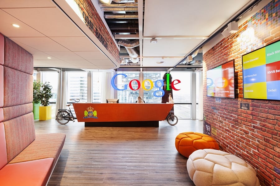 Reception desk with Dutch royal familys coat of arms at Google Amsterdams Headquarters Google Amsterdam Office: A Tour Through The Whimsical And The Functional!