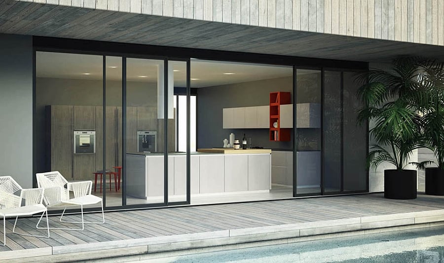 Sliding glass doors connect the kitchen with the deck outside