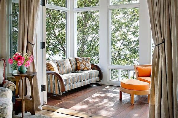 Added porch with sunroom design that gets the eye