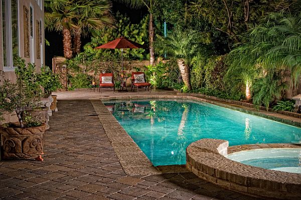 luxurious backyard pool with lounge chairs