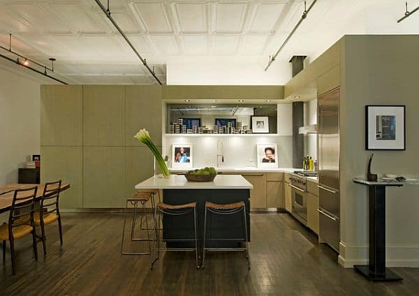 A corner loft kitchen with neutral colors that charm