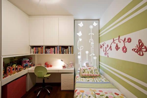 Contenporary girls' bedroom incorporates a small desk elegantly