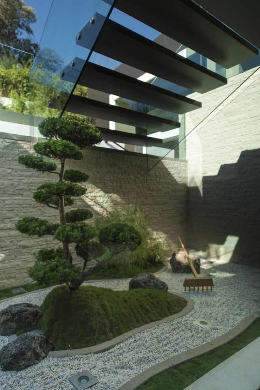 Floating staircase above an interior landscape