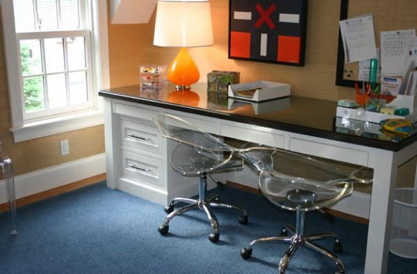 Kid's desk with reclaimed pine wood works well with chic modern chairs