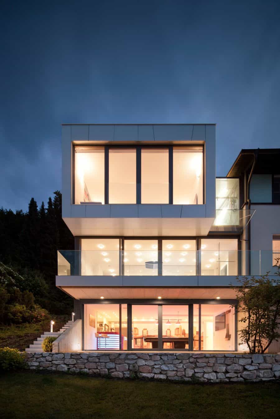 Large glass windows used to offer lake views Elegant Austrian Home Blends Lovely Lake Views With A Minimalist Interior