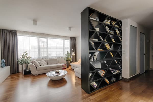 Large windows in the living room provide plenty of natural light