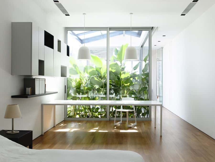 Modern bedroom with glass windows