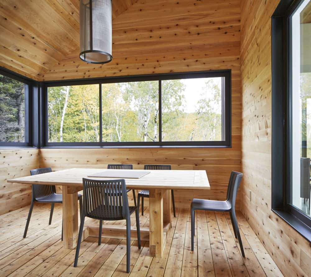 House with wooden feature House with wooden feature Reinterpretation of a Traditional Barn: Malbaie VIII Residence in Canada